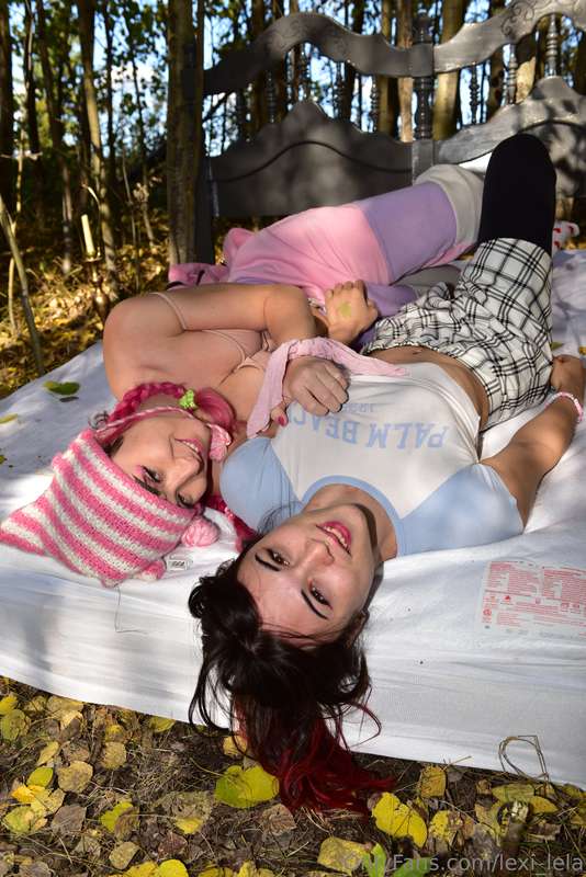 two girls on a bed in the woods... what are they gonna do to..