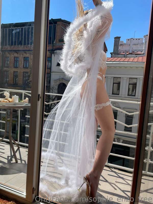Stand beside me on the balcony and let the white lingerie te..