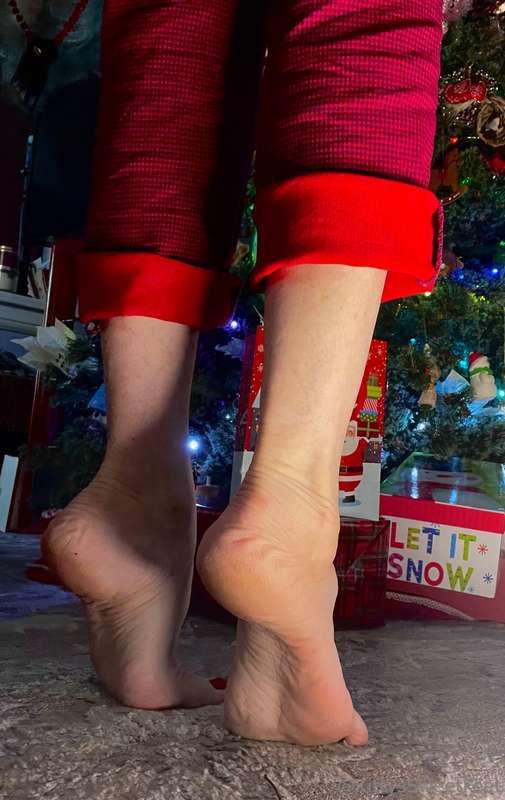 Santa stood, his hands gliding up her legs, his touch sendin.. 2
