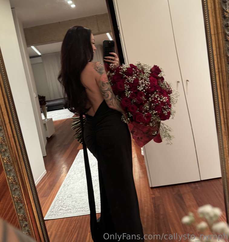The deep neckline on my back is a subtle hint, a play of lig..