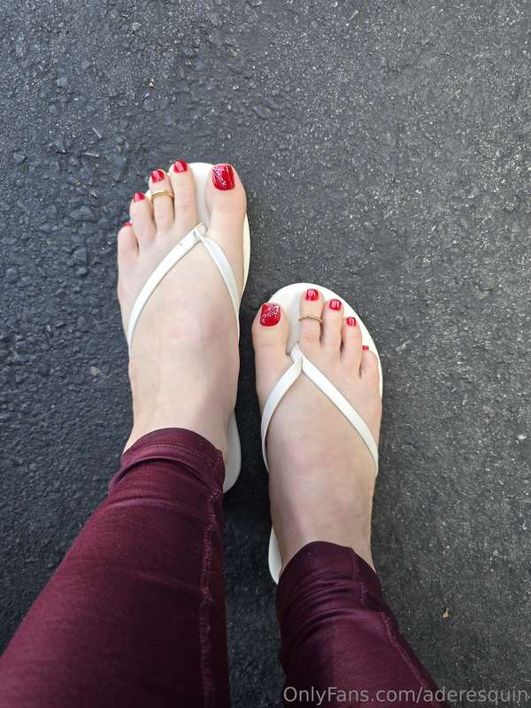 Showing off my red toes in white flip flops  @aderesquin