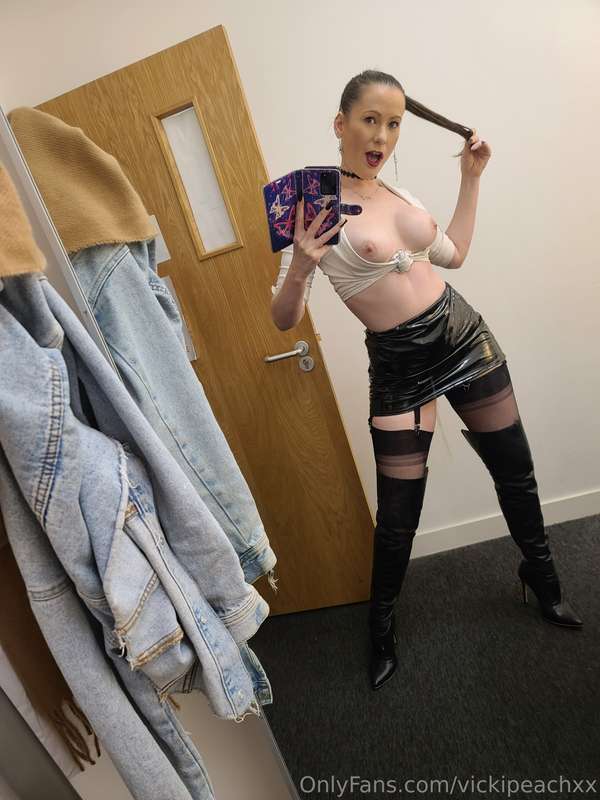 Dressed in fully fashion stockings thigh high boots pvc skir.. 3