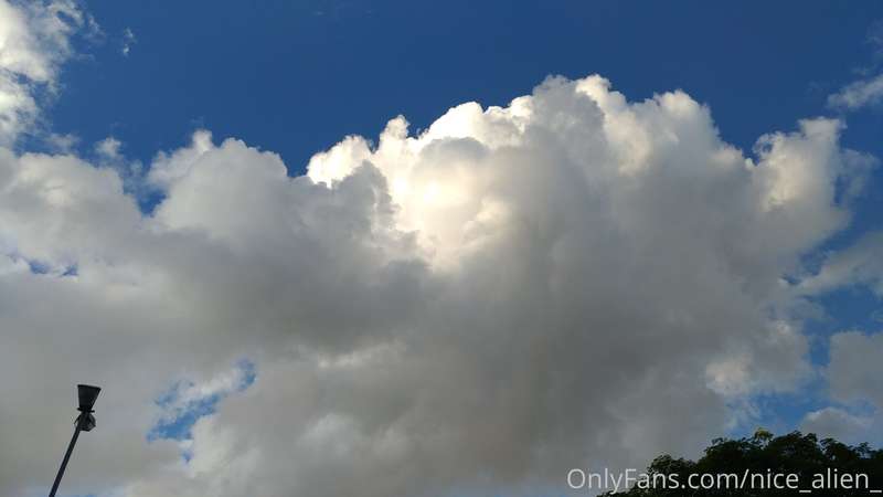 The sun is not behind the clouds, it's reflecting on them.