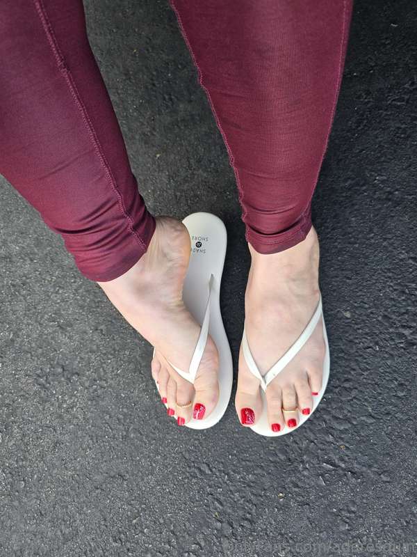 Showing off my red toes in white flip flops  @aderesquin 3