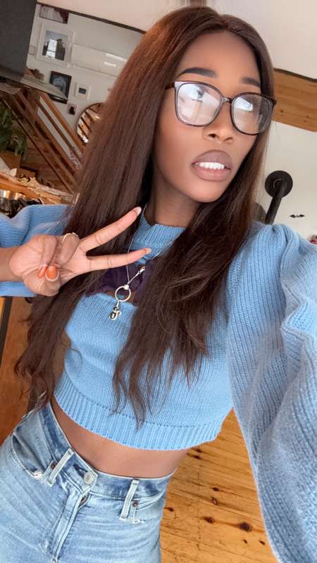 glasses on, peace sign up. really, im begging you to stare a..