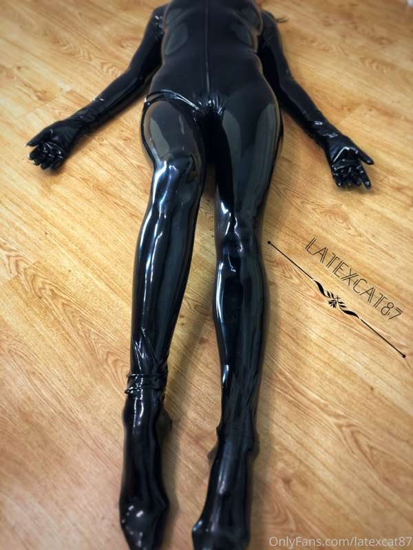 Black latex on my lithe body. 9