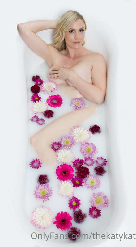 Bath time.  Me.  Flowers.  Close shot of breast and nipple. ..