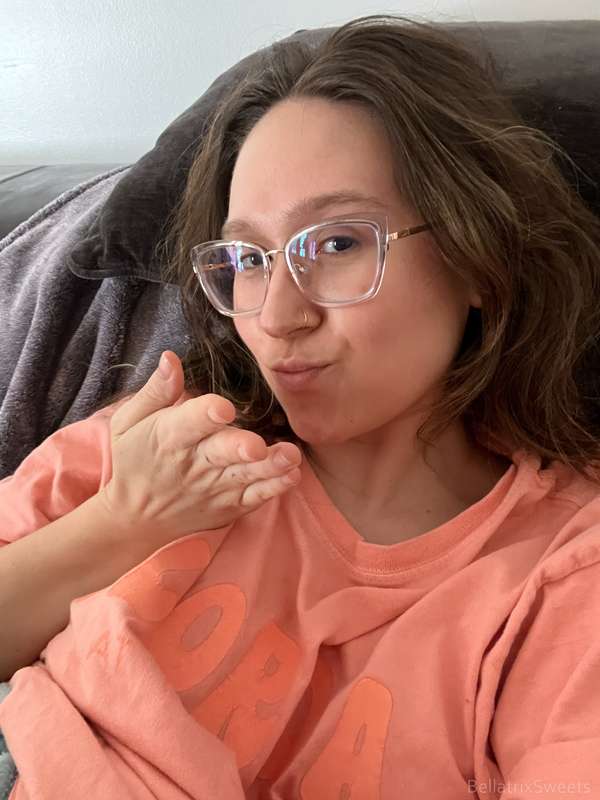 blowing you a kiss and showing you my boobs