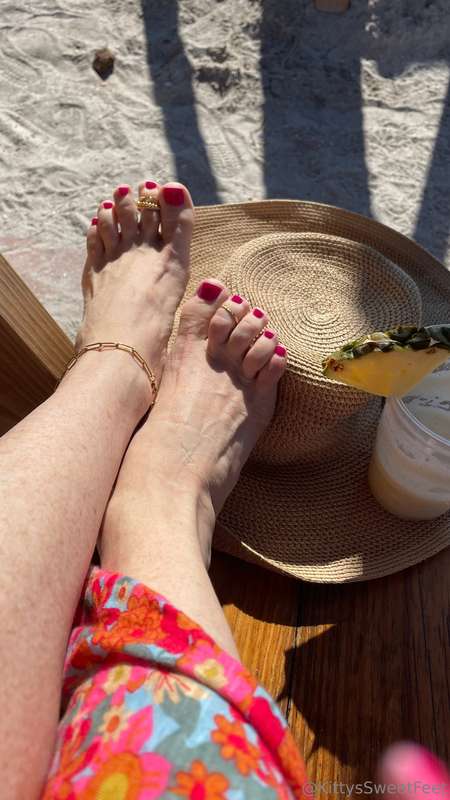 Soaking up the sun at St. Pete Beach, Florida—piña colada in.. 5
