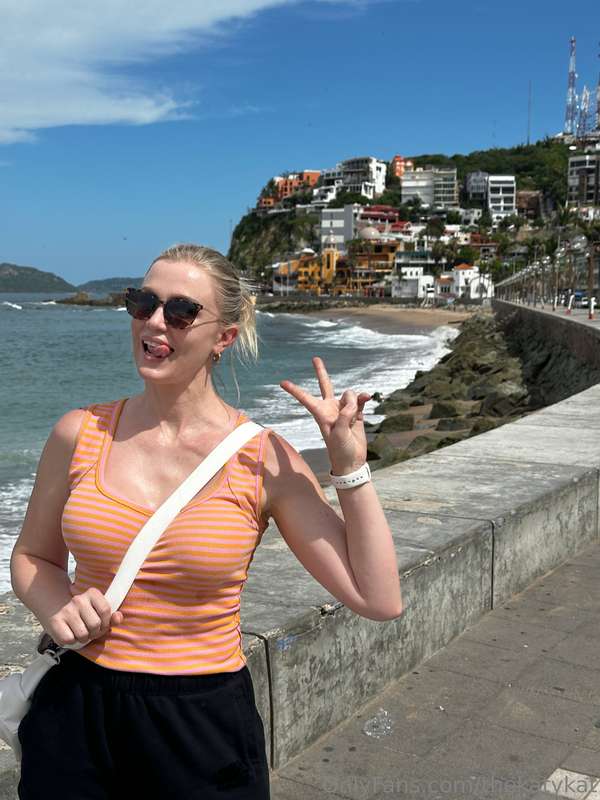 Peace sign up, boob sweat down.