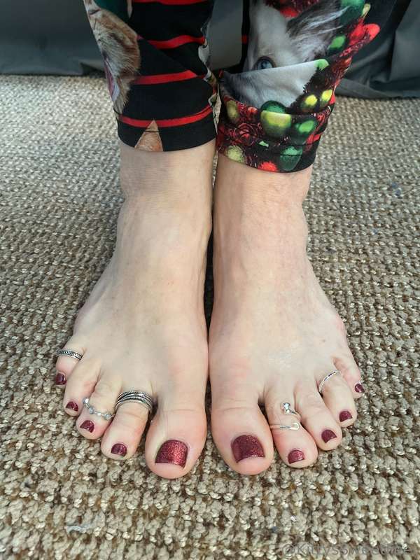 Soft, creamy white skin and perfectly pedicured toes adorned..