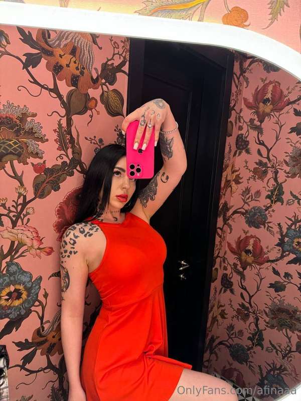 A red dress is a bold choice that expresses individuality an..