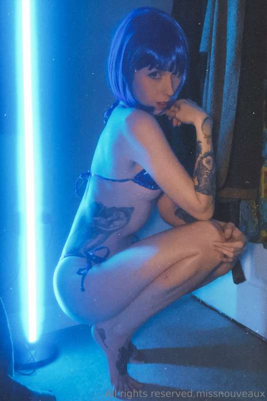 Blue wig. Neon blue lingerie. 5 topless shots. Bare feet. To.. 1