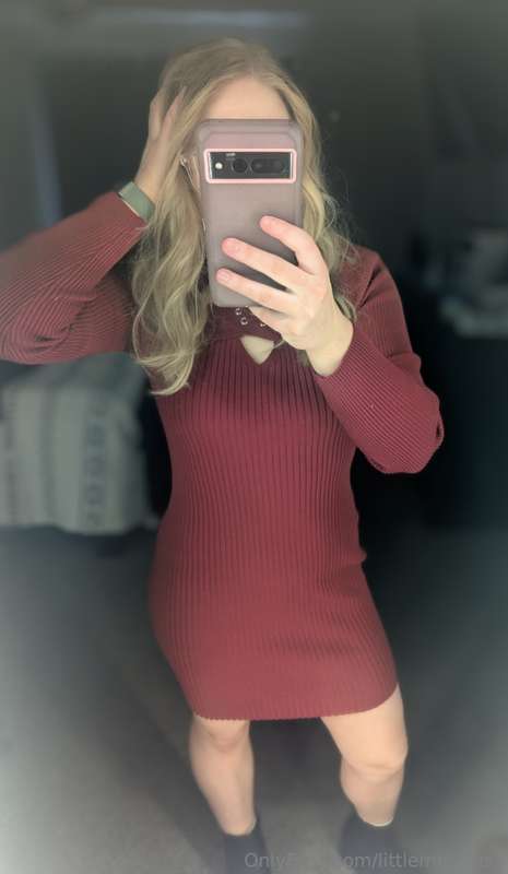 Her red dress whispered promises of a wild weekend, a scarle..