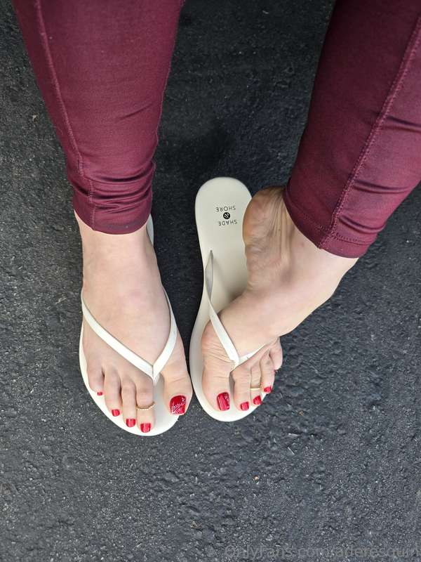 Showing off my red toes in white flip flops  @aderesquin 2
