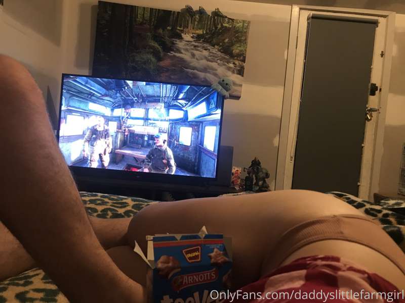 Watching daddy game and snacking before bed.   Through in a ..