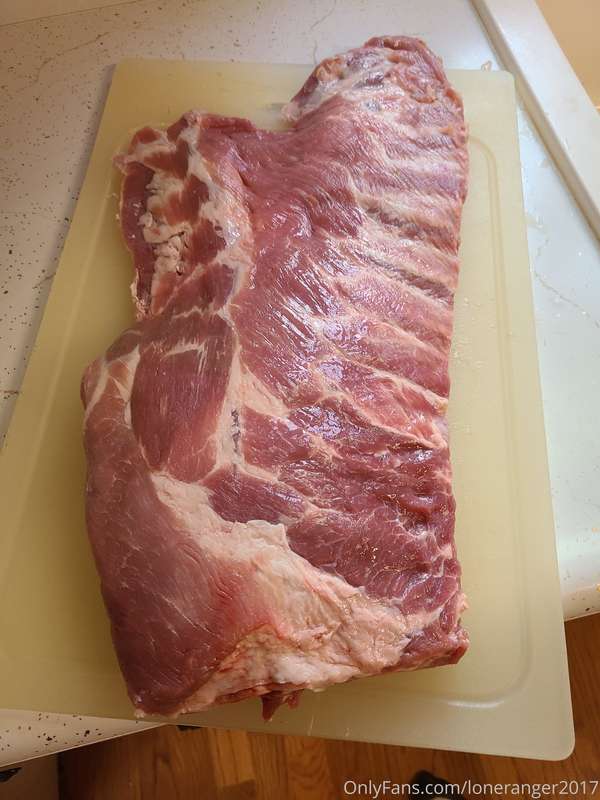 A nice rack of pork spare ribs going in the smoker for BBQ r..