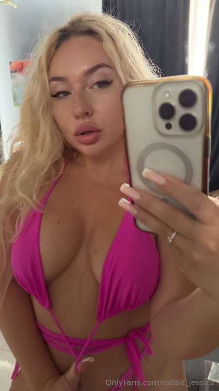 Blonde in a pink bikini mmm... this is definitely a turn on ..